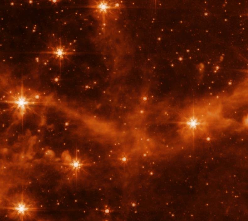 随着这幅图像从斯皮策看到的过渡到韦伯看到的，大麦哲伦星云逐渐变得清晰.jpg