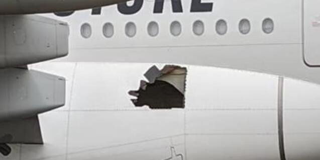 阿联酋客机落地后发现机身有大破洞，飞机平安落地  　　